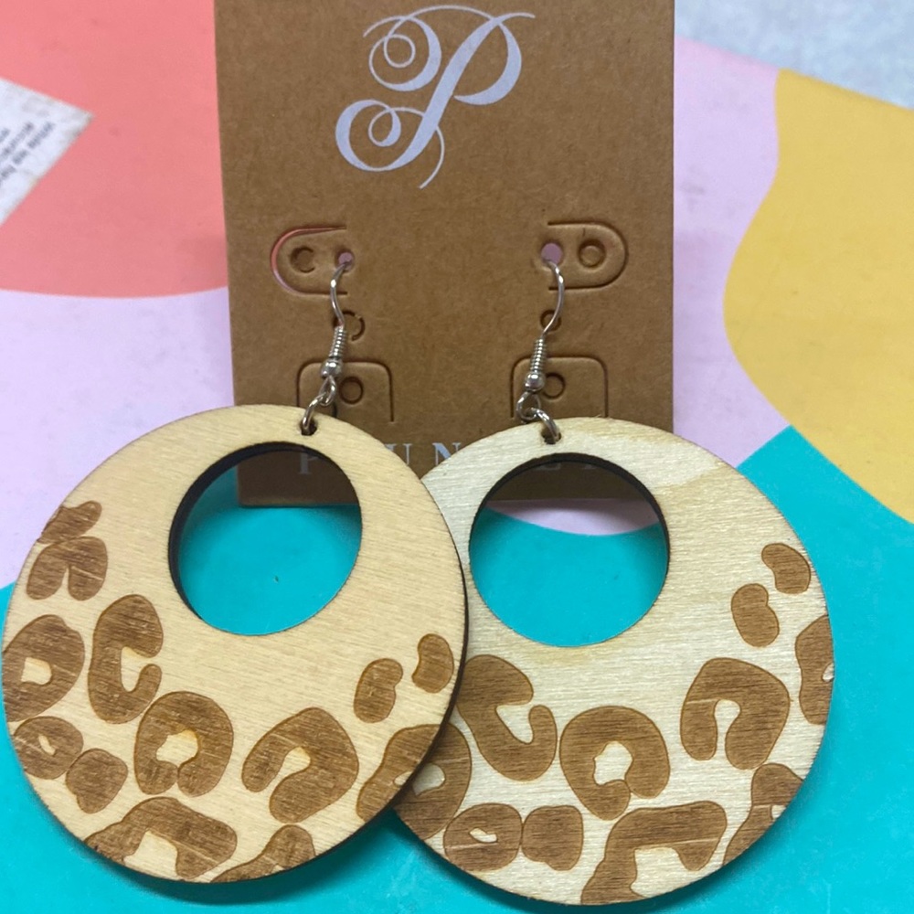 Laser cut wooden hoop earrings with leopard print.